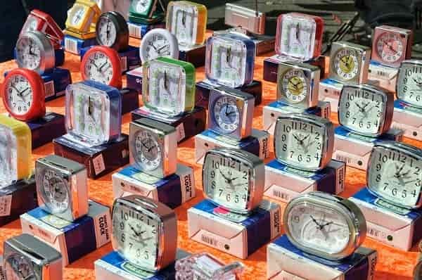 a collection of analog clocks ticks away the minutes and hours
